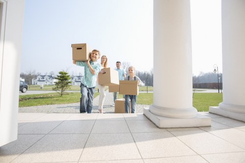Professional moving team handling items in Pimlico