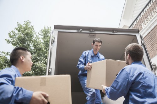 Loading household items into a moving truck in Pimlico with care
