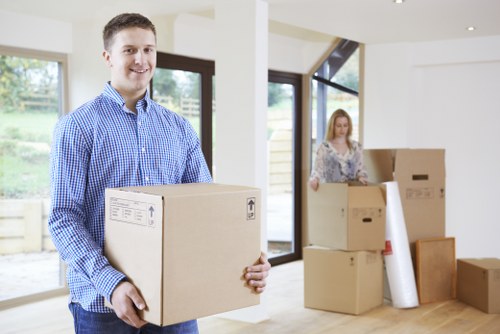 Mover using safety equipment while loading items into a van