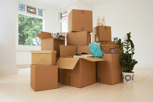 Organised moving boxes and desks ready for office relocation in central London