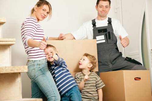 Unpacking household items into a Pimlico flat after moving day